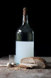 Foto: Old bottle with alcohol, wheat, corn, glass and garlic Old bottle with alcohol, wheat, corn, glass and garlic