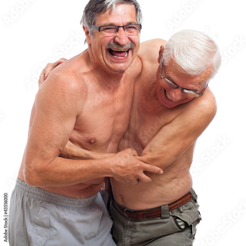 Photo: Laughing seniors fighting for fun Laughing seniors fighting for fun