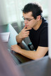 Photo: Self-employed man working at home Self-employed man working at home