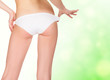 Foto: female backside, green blurred background female backside, green blurred background