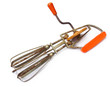 Vintage egg beater over white background