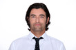 Head and shoulders of a man in a shirt and tie