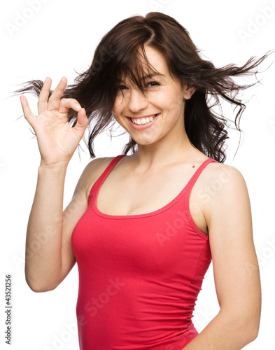 Photo: Woman is showing OK sign Woman is showing OK sign
