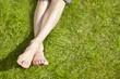 Young Adult sunbathing on grass