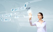 Foto: Businesswoman and touch screen technology Businesswoman and touch screen technology