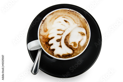 Photo: cup of cappuccino with artistic cream decoration indian design cup of cappuccino with artistic cream decoration indian design