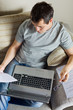 Photo: Self-employed man working at home Self-employed man working at home