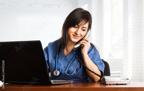 Photo: Nurse talking on the phone Nurse talking on the phone