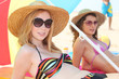 Women with hat on the beach