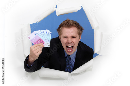 Photo: A businessman with plenty of cash. A businessman with plenty of cash.