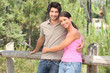 A nice couple hugging in a park.