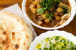 Close up of soup lagman decorated with greens and lavash