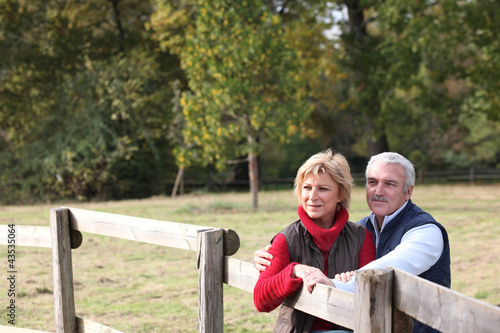 Photo: Couple by a paddock Couple by a paddock