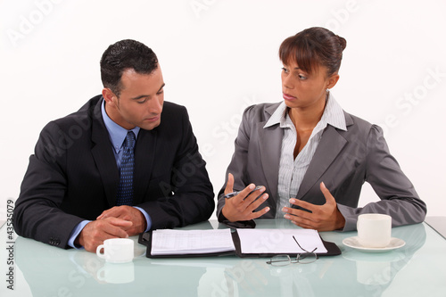 Photo: Man and woman in businessmeeting Man and woman in businessmeeting