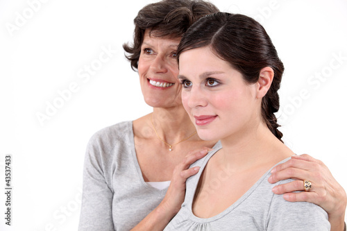 Photo: Grandmother holding granddaughter around the shoulders Grandmother holding granddaughter around the shoulders