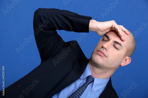 Photo: businessman having a headache businessman having a headache