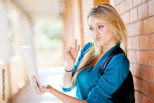 Photo: college student using tablet computer communicate with friends college student using tablet computer communicate with friends