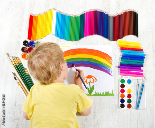Photo: Child painting picture with brush in album using a lot of painti Child painting picture with brush in album using a lot of painti
