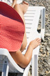 Young girl in hat sitting on lounge