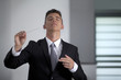Businessman conducting his work and business with his baton