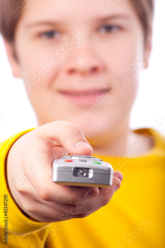 Photo: Handsome chubby teenage boy changing channels Handsome chubby teenage boy changing channels