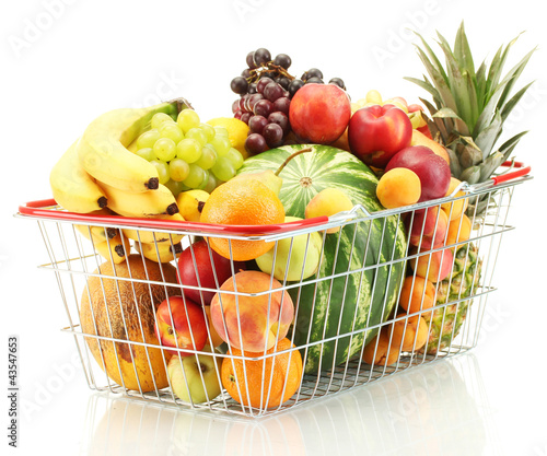 Foto: Assortment of exotic fruits in metal basket isolated on white Assortment of exotic fruits in metal basket isolated on white