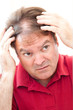 Photo: Man Worried About Balding Man Worried About Balding