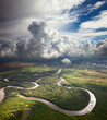 Forest river under the white clouds