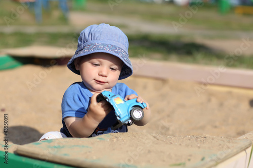 Photo: Child holding broken toy car Child holding broken toy car