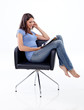 Photo: Beautiful 20s girl sitting in a chair and reading Beautiful 20s girl sitting in a chair and reading