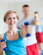 Couple working out with dumbbells