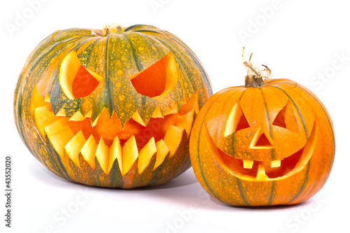 Photo: Halloween pumpkins with scary face over white background Halloween pumpkins with scary face over white background