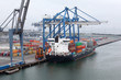 Foto: Cargo ship in Copenhagen seaport at misty morning, Denmark; Cargo ship in Copenhagen seaport at misty morning, Denmark;