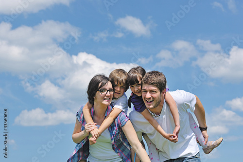 Photo: happy young family have fun outdoors happy young family have fun outdoors
