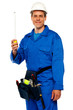 Building worker holding measuring tape