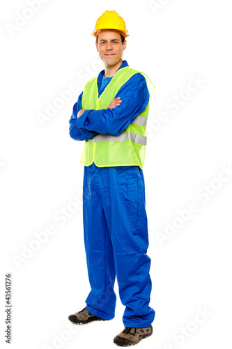 Photo: Handsome male repairman posing in style Handsome male repairman posing in style