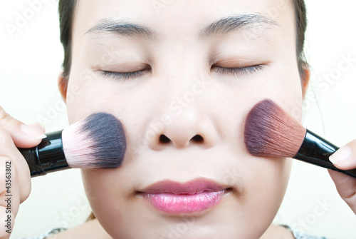 Photo: Close up Asian young woman make up. Close up Asian young woman make up.