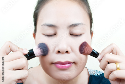 Photo: Close up Asian young woman make up. Close up Asian young woman make up.