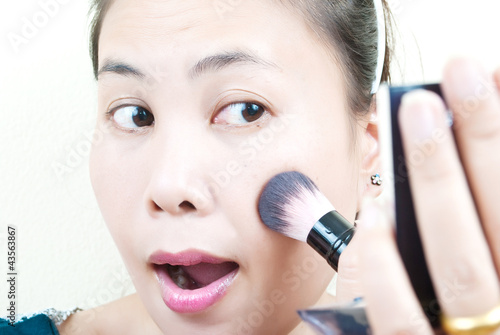 Photo: Close up Asian young woman make up. Close up Asian young woman make up.