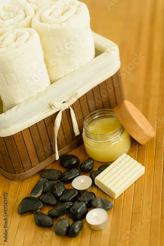 Photo: Spa body care products and towels close-up Spa body care products and towels close-up