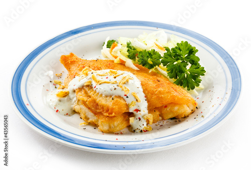 Photo: Fish dish - fried fish fillets and vegetable salad Fish dish - fried fish fillets and vegetable salad