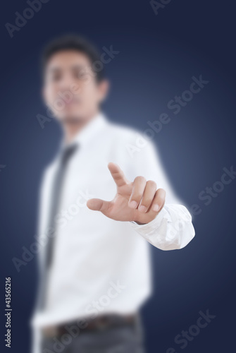 Photo: Businessman pushing on the whiteboard. Businessman pushing on the whiteboard.