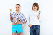 Couple with paint brushes