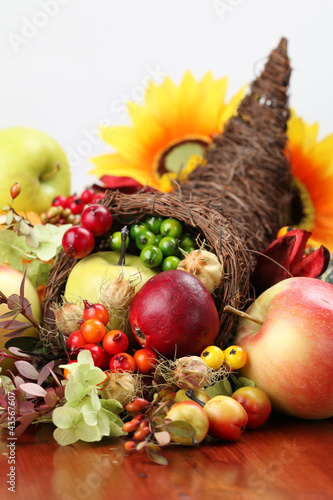 Photo: Autumn cornucopia - symbol of food and abundance Autumn cornucopia - symbol of food and abundance