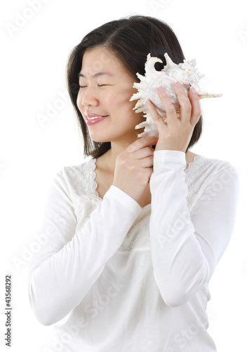 Photo: Listening to a seashell Listening to a seashell