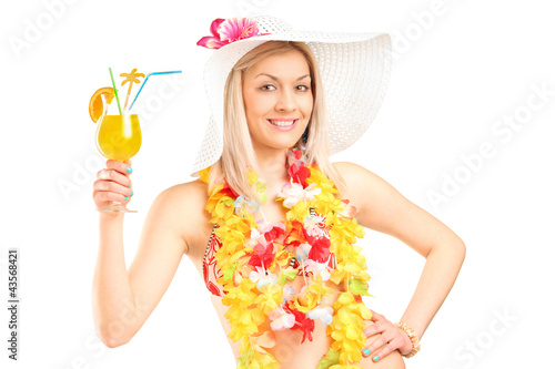Photo: Portrait of a female dressed in a hawaiian costume holding a coc Portrait of a female dressed in a hawaiian costume holding a coc