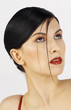 Studio shot of a lady with makeup looking up
