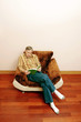Man sitting on the couch reading book