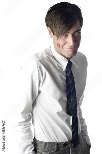 Photo: Businessman with a lipstick stain on his cheek Businessman with a lipstick stain on his cheek