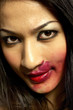 Photo: Woman with red lipstick smudged around her lips Woman with red lipstick smudged around her lips